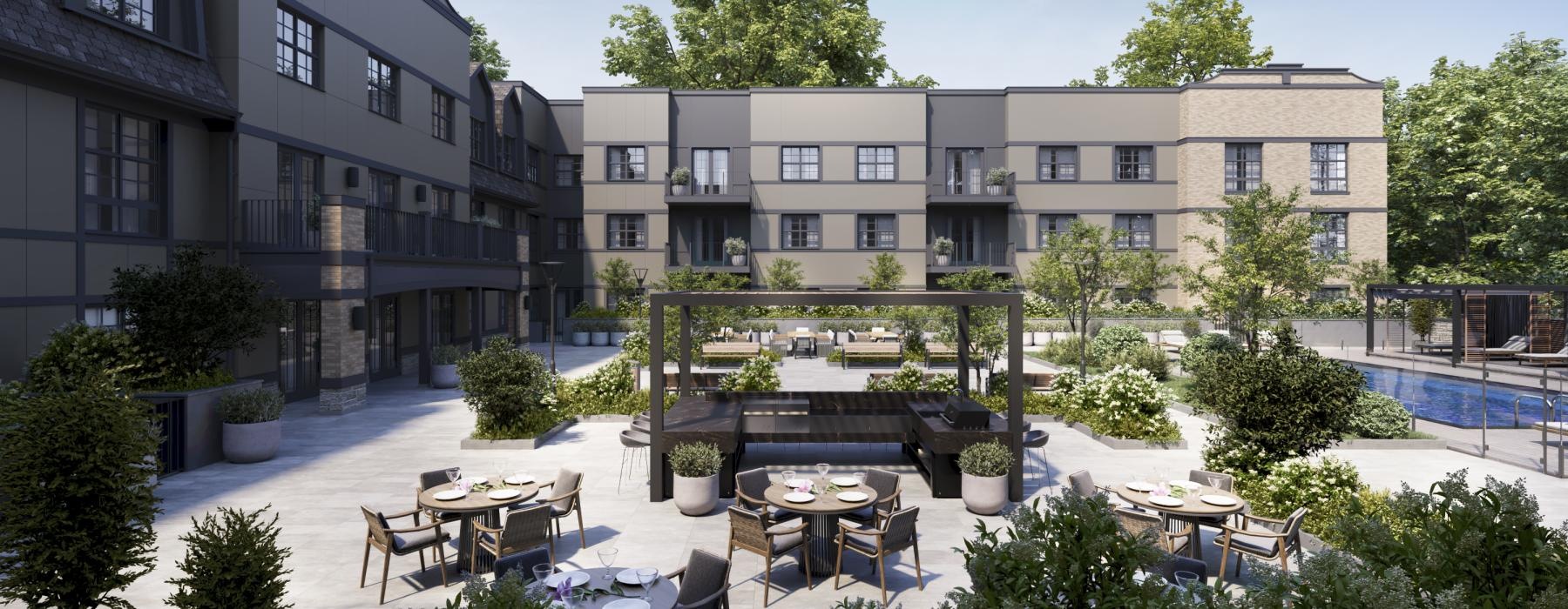 a courtyard with tables and chairs and buildings in the background