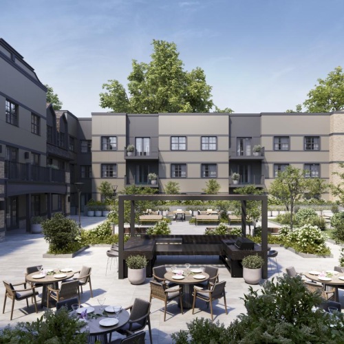 a courtyard with tables and chairs and buildings in the background